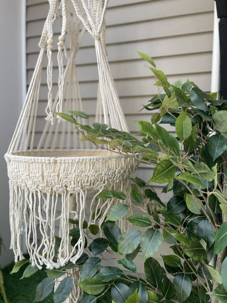 macramé hammock for cats and a tree in a catio