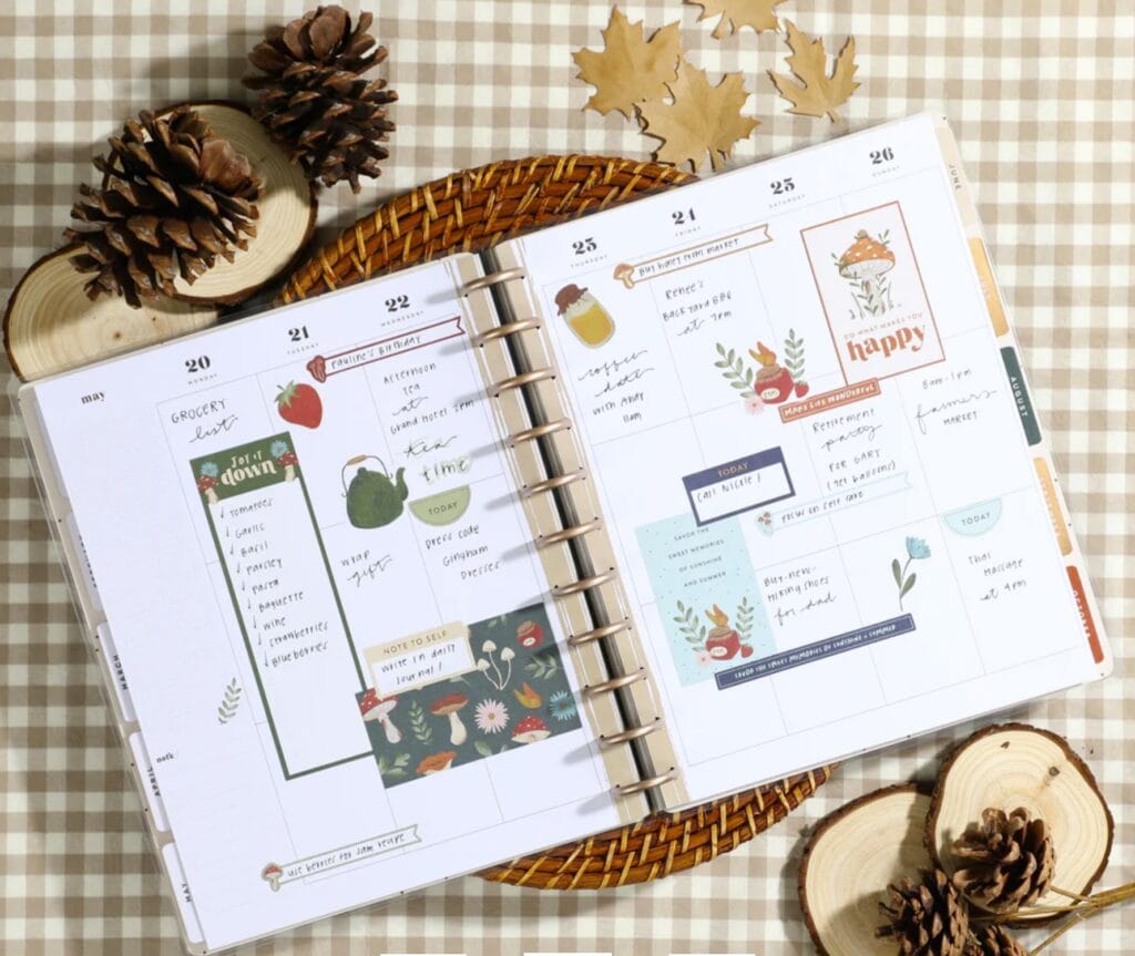 decorated paper planner on a table with fall leaves