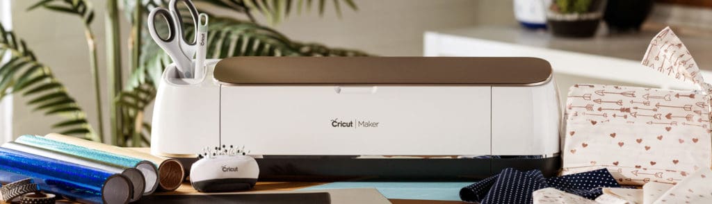 picture of a Cricut machine on a desk with accessories.  What do you do with a Cricut machine?