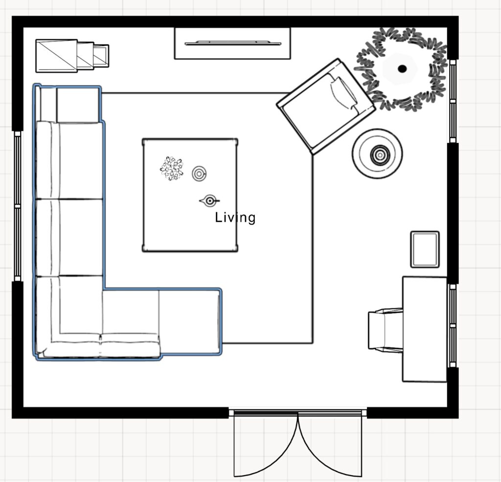 floor plan showing a sectional and chair arrangement with a tv