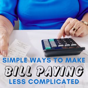 woman using a calculator to add up receipts