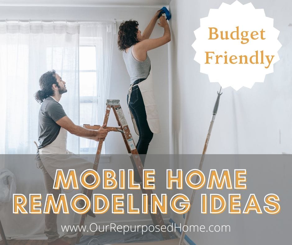 couple painting a mobile home wall