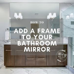 bathroom with a frameless mirror