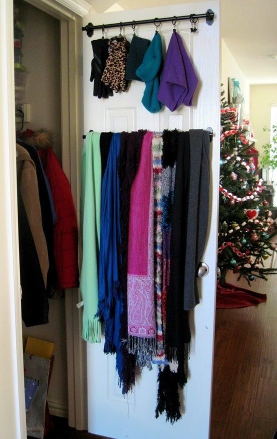how to hang scarves in a closet. scarves and winter accessories hanging on a closet door