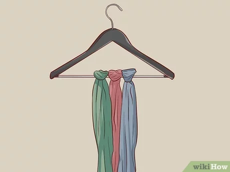 how to hang scarves in a closet. scarves tied onto a clothes hanger